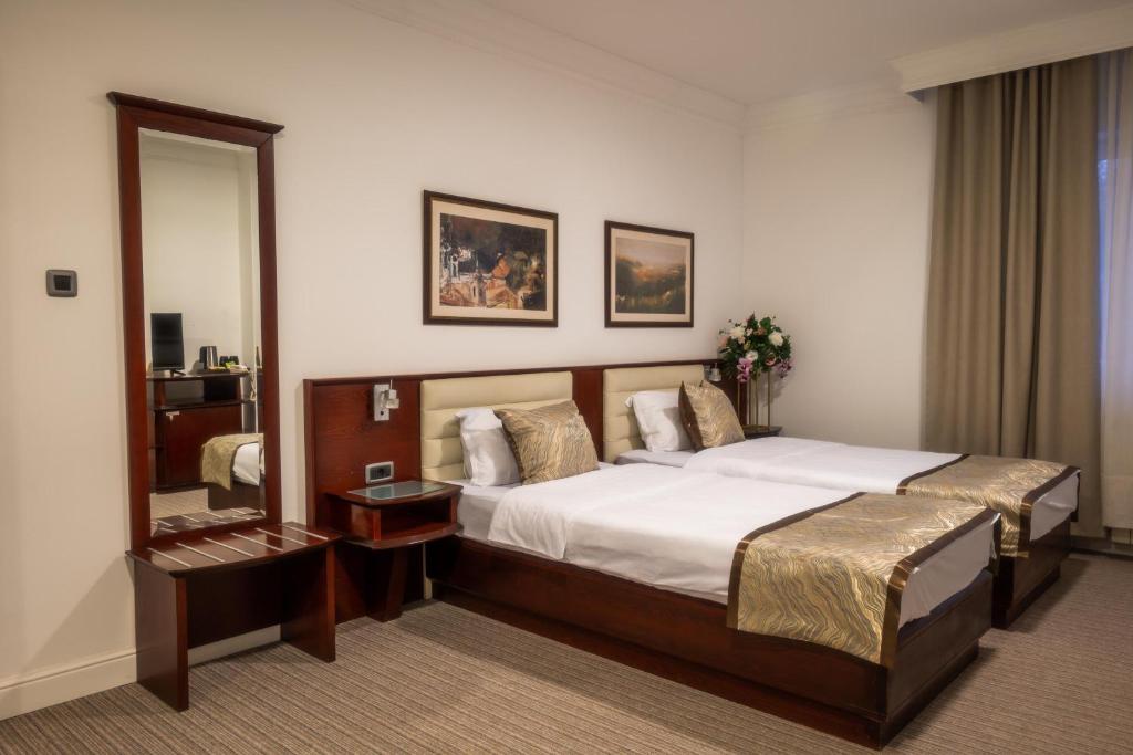 Letto o letti in una camera di Hotel Mio City