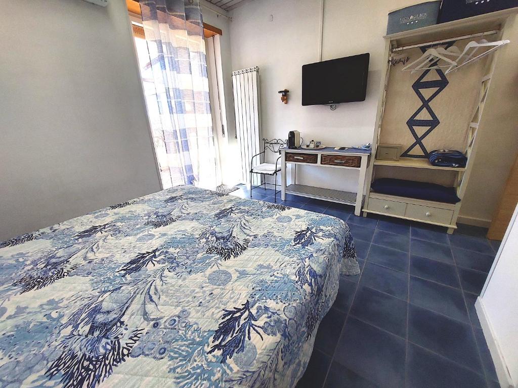 Postel nebo postele na pokoji v ubytování Nughe 'e' Oro Guesthouse