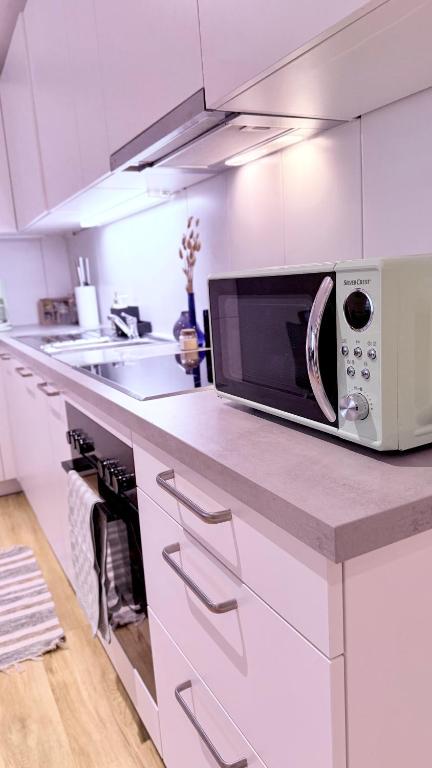 Kuchyň nebo kuchyňský kout v ubytování Cozy cove