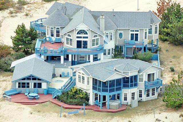 an aerial view of a large house on the beach at Y1485- Sunnybank in Corolla