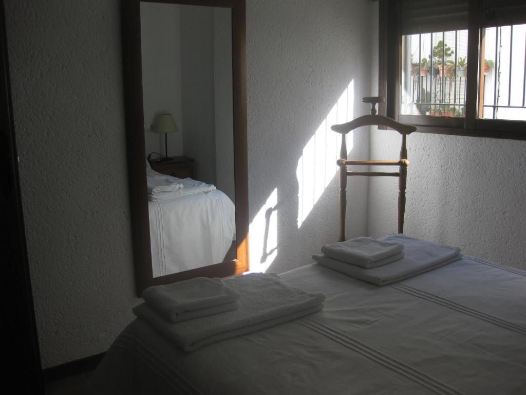 Postel nebo postele na pokoji v ubytování Casa Viola De Cazorla
