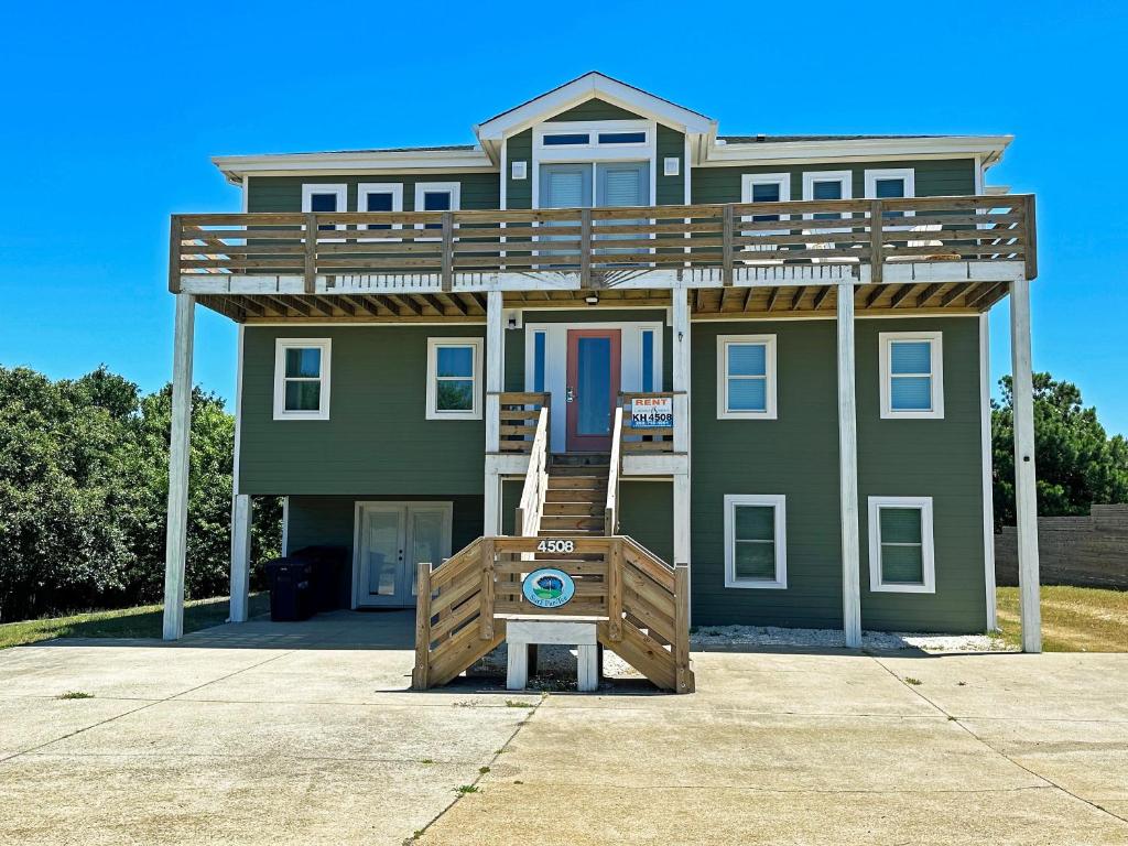 a house with a deck on top of it at KH4508- Surf Par-Tee in Kitty Hawk