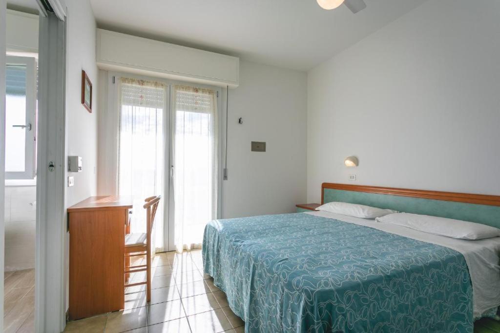 Postel nebo postele na pokoji v ubytování Hotel del Falco