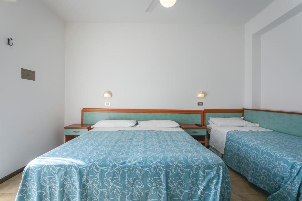 Postel nebo postele na pokoji v ubytování Hotel del Falco