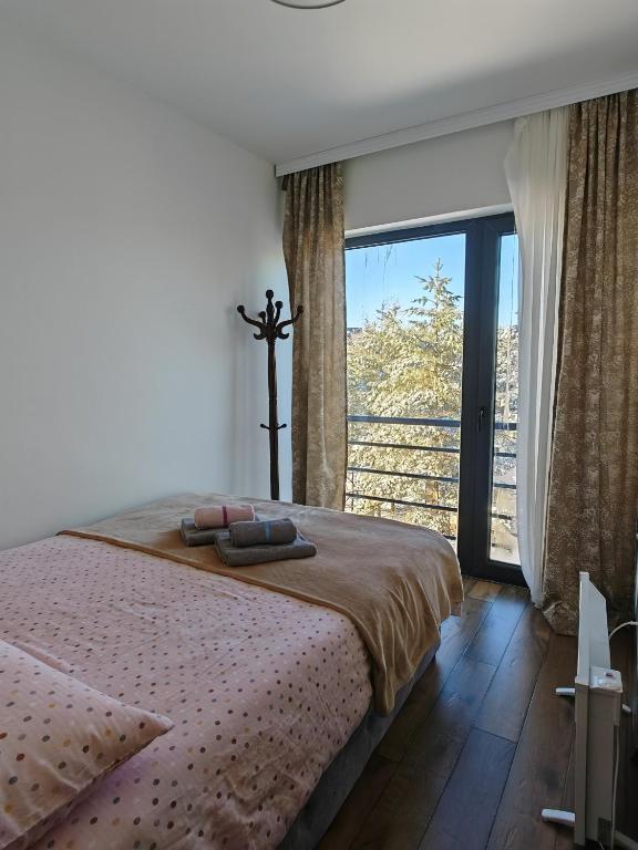 Una cama o camas en una habitación de Apartman Monika Wind Resort