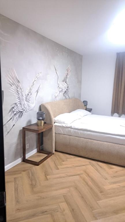Postel nebo postele na pokoji v ubytování Villa Grudziądz