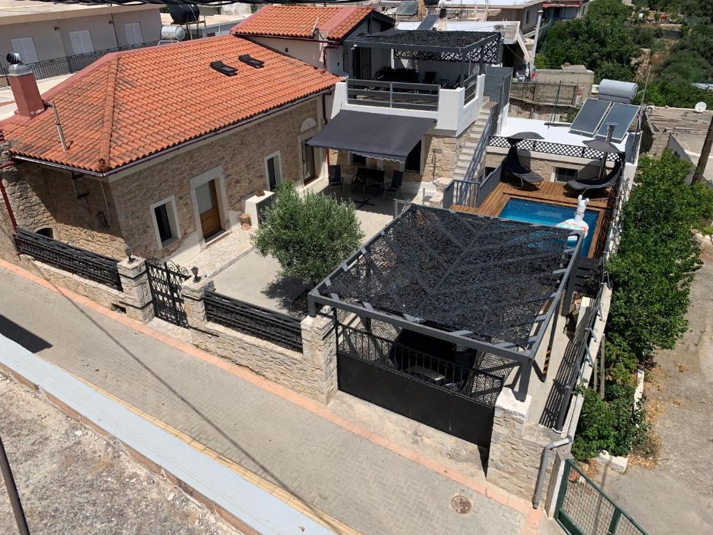 an aerial view of a house with a swimming pool at Thrapsano House with Private Pool for Families by Hospi Living in Heraklion