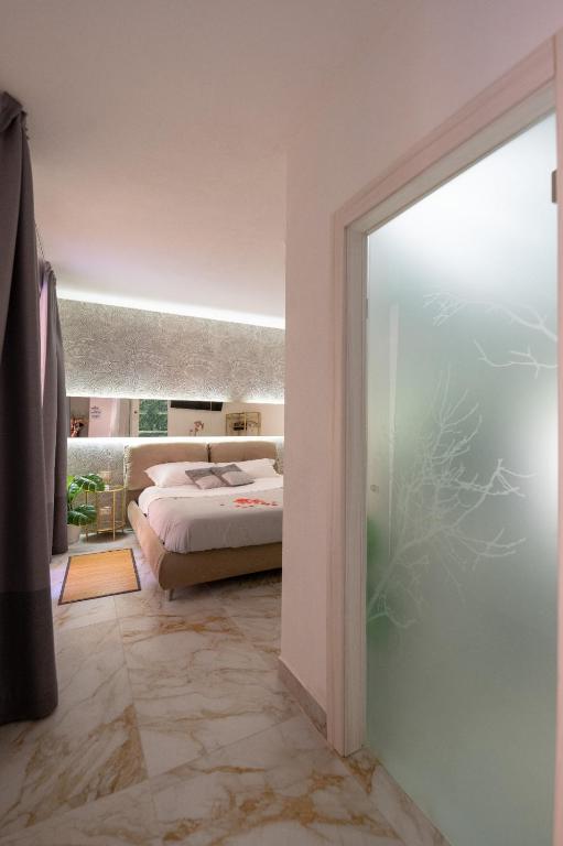 Voodi või voodid majutusasutuse ETNEA 208 LUXURY JACUZZI SUITE Catania toas