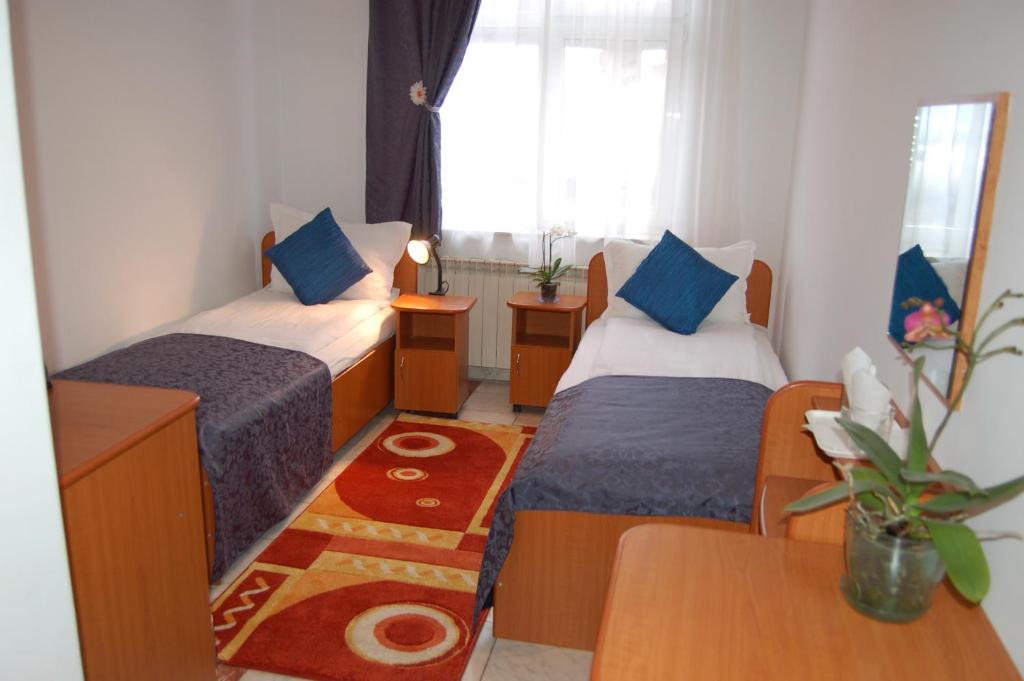 Postel nebo postele na pokoji v ubytování Motel Maestro