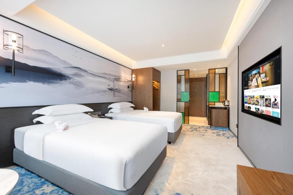 TV a/nebo společenská místnost v ubytování Sanyu Hotel