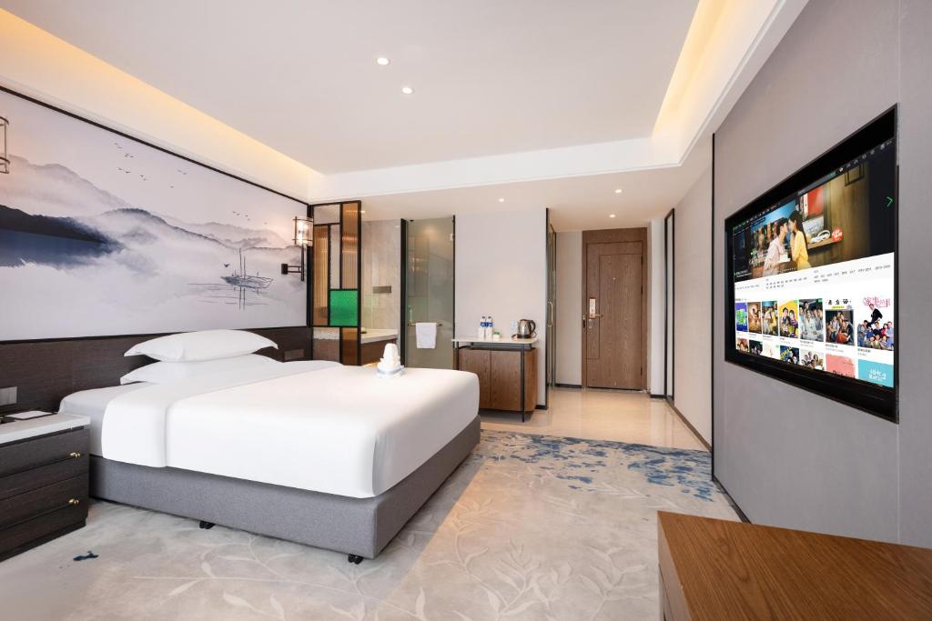TV a/nebo společenská místnost v ubytování Sanyu Hotel