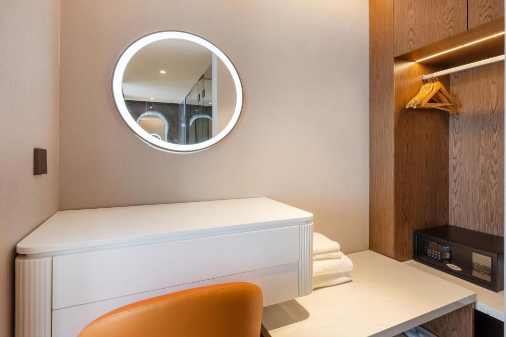 Postel nebo postele na pokoji v ubytování Sanyu Hotel