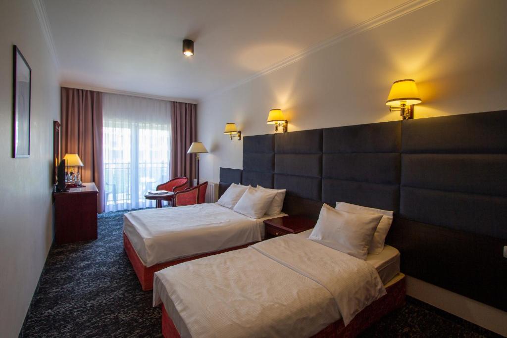 Posteľ alebo postele v izbe v ubytovaní Royal Park Hotel & Spa
