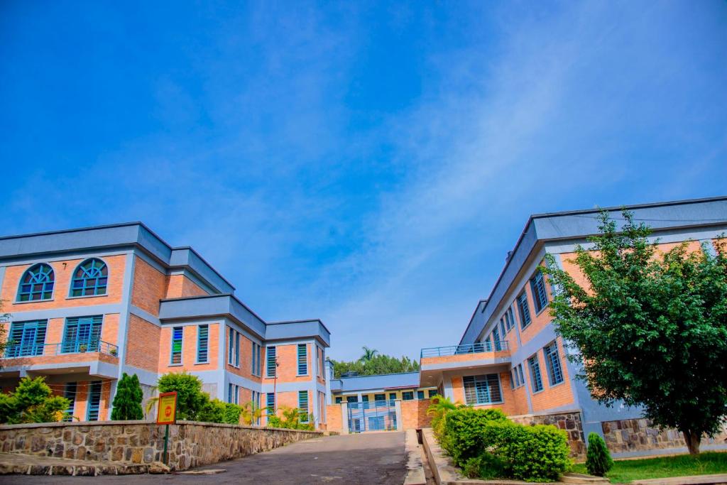 a row of buildings with a blue sky in the background at Centre Missionnaire Lavigerie in Kigali