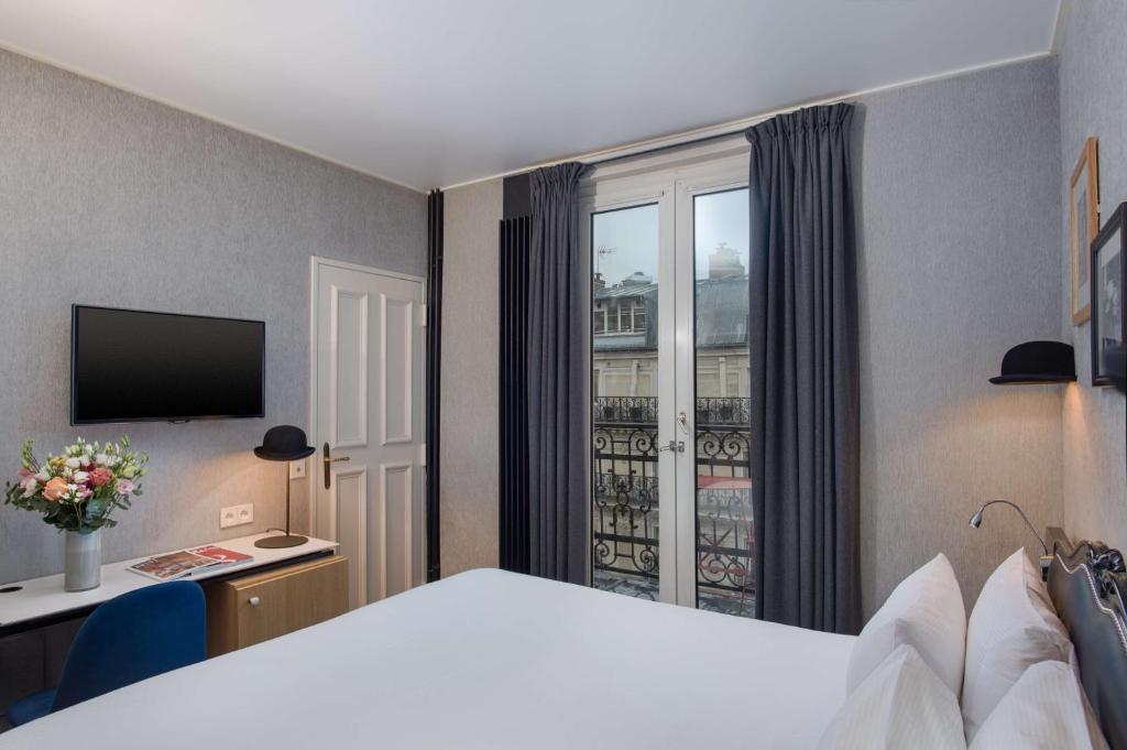 Postel nebo postele na pokoji v ubytování NH Paris Opéra Faubourg