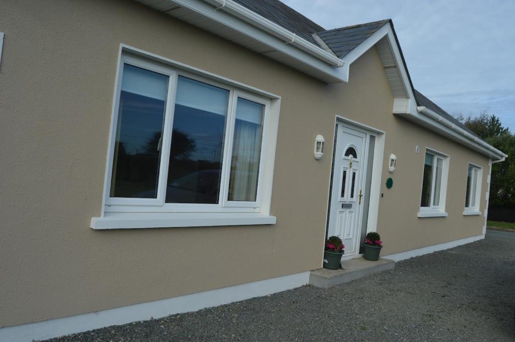 a house with a window on the side of it at High Meadow House in Duncormick