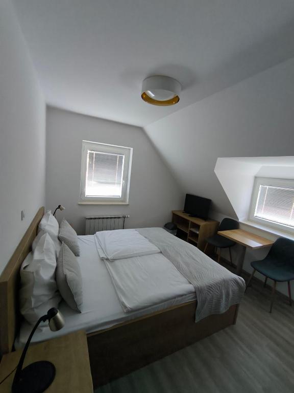 Guesthouse Haler 객실 침대