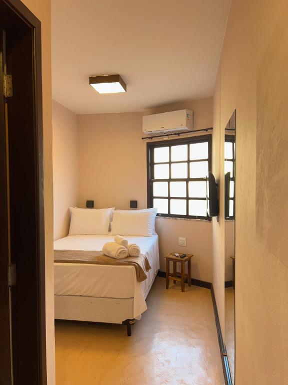 Postel nebo postele na pokoji v ubytování Balanço do Mar Rooms
