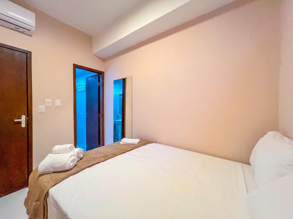 Postel nebo postele na pokoji v ubytování Balanço do Mar Rooms