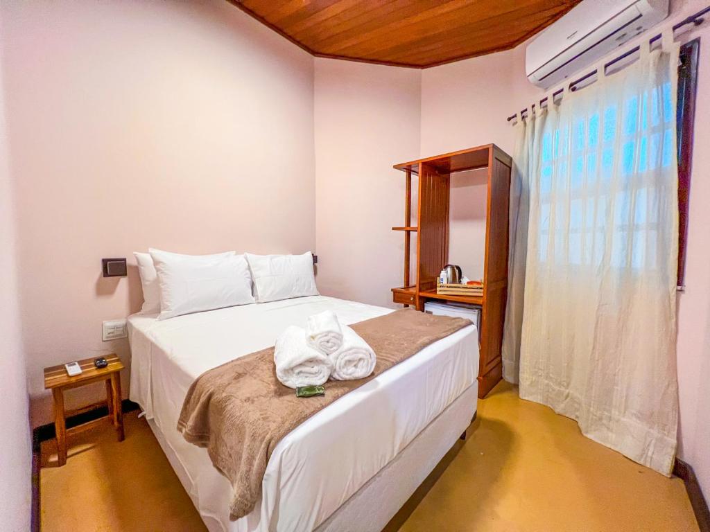 Postel nebo postele na pokoji v ubytování Balanço do Mar Rooms