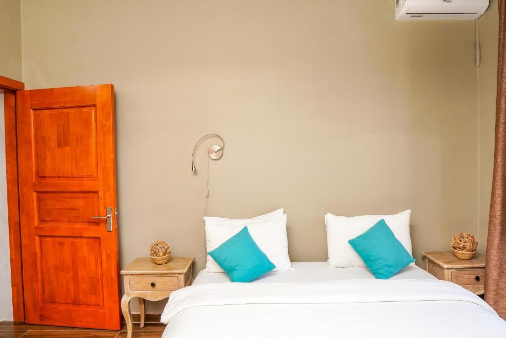 Postel nebo postele na pokoji v ubytování Aquamarina Hotel