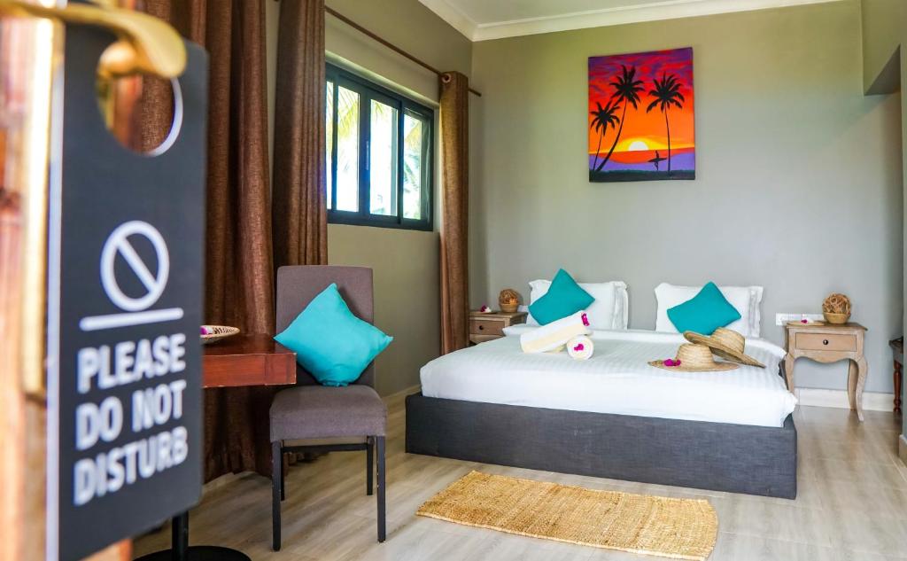 Postel nebo postele na pokoji v ubytování Aquamarina Hotel