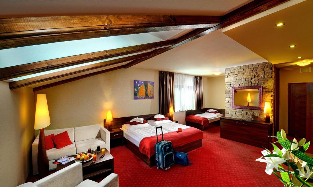Postel nebo postele na pokoji v ubytování Wellness Hotel Chopok