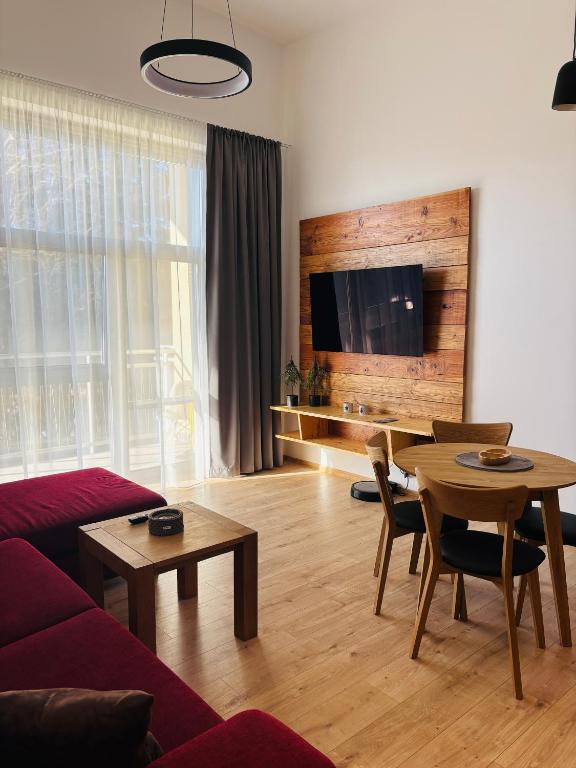 TV a/nebo společenská místnost v ubytování Evergreen Tále Apartments