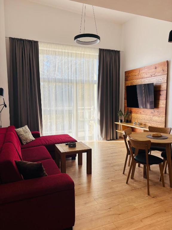 TV a/nebo společenská místnost v ubytování Evergreen Tále Apartments
