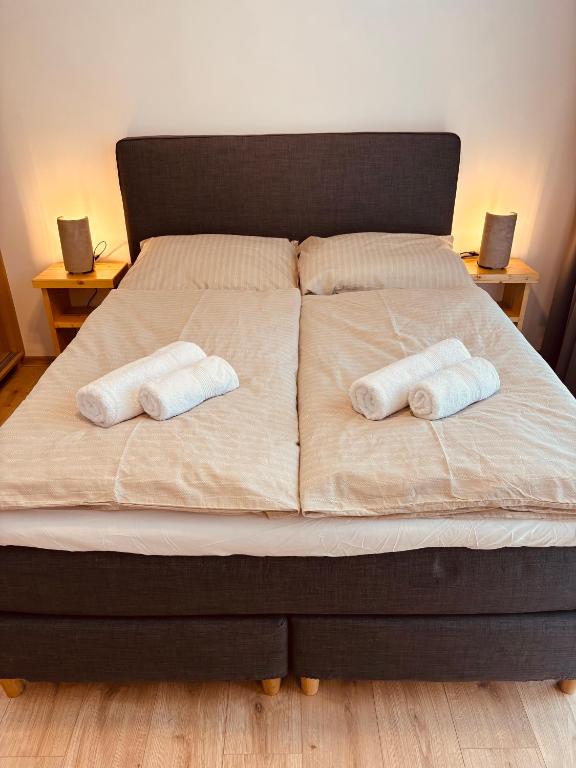 Postel nebo postele na pokoji v ubytování Evergreen Tále Apartments