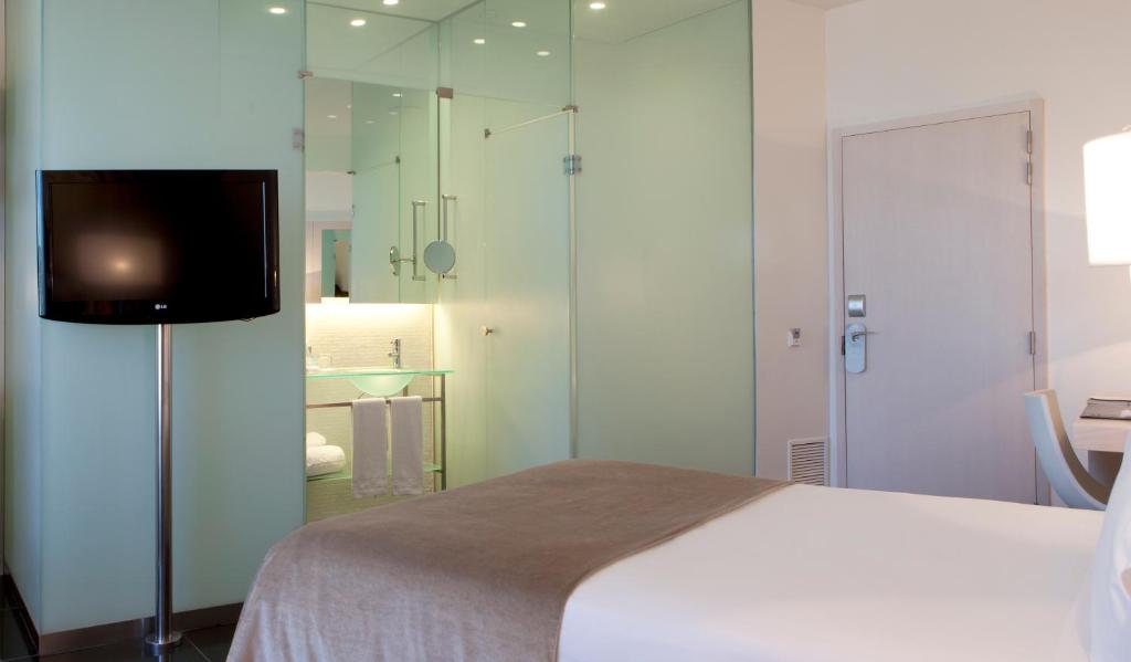 מיטה או מיטות בחדר ב-Hotel Porta Fira 4* Sup