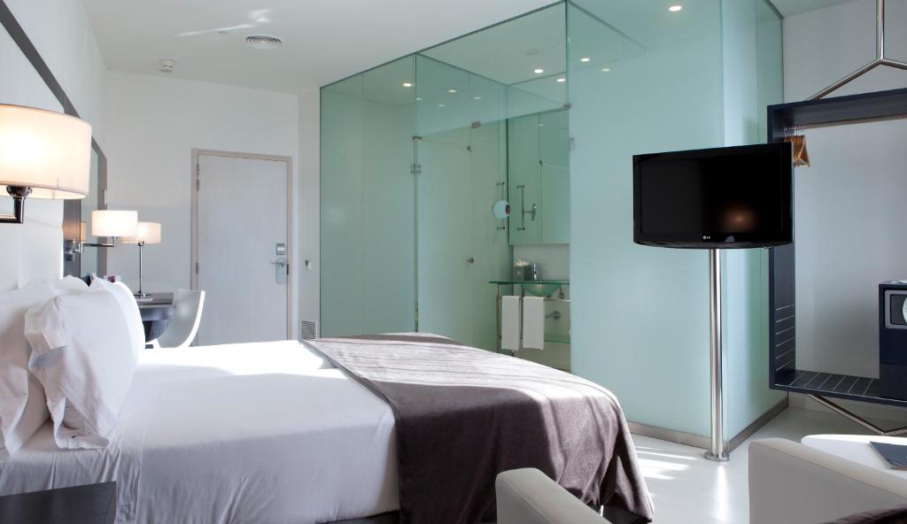 מיטה או מיטות בחדר ב-Hotel Porta Fira 4* Sup