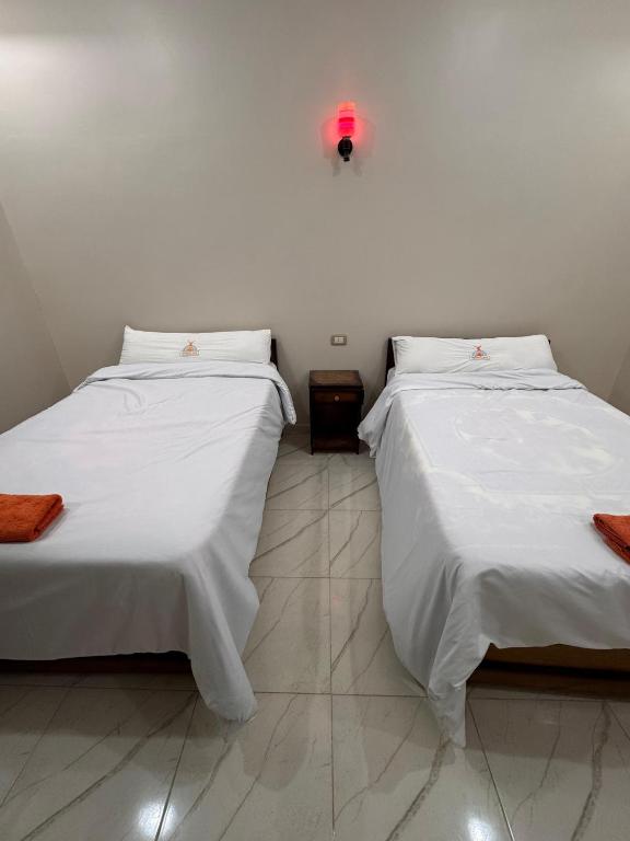 Postel nebo postele na pokoji v ubytování Al-Manara Hostel Siwa Oasis 2
