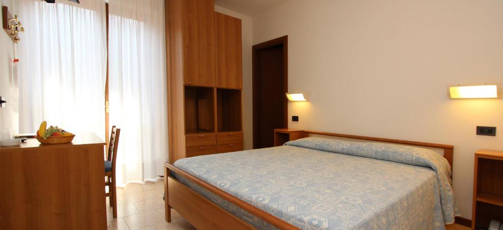 Posteľ alebo postele v izbe v ubytovaní Hotel Garnì Al Poggio