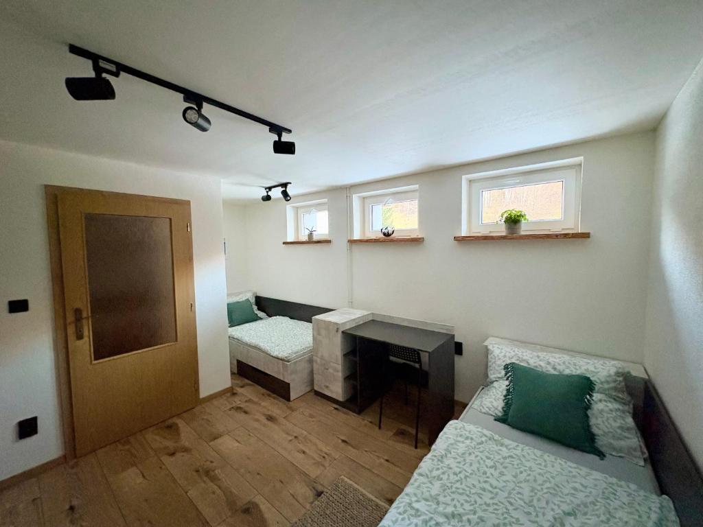 Postel nebo postele na pokoji v ubytování Apartmány Faunapark