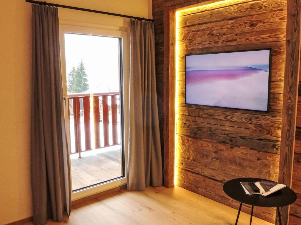 Μια τηλεόραση ή/και κέντρο ψυχαγωγίας στο Apartment Wiedersehn Dachgeschoss by Interhome
