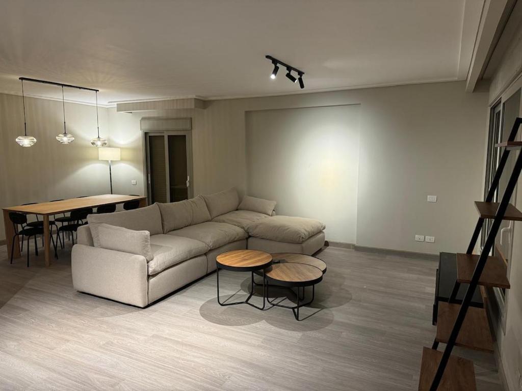 a living room with a couch and a table at The Pyramid Escape in Cairo