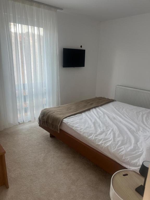 Postel nebo postele na pokoji v ubytování LaLa HOME