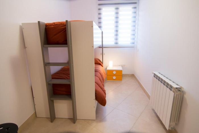 Posteľ alebo postele v izbe v ubytovaní Apartament Bagà