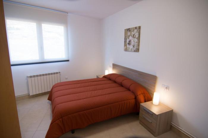 Posteľ alebo postele v izbe v ubytovaní Apartament Bagà