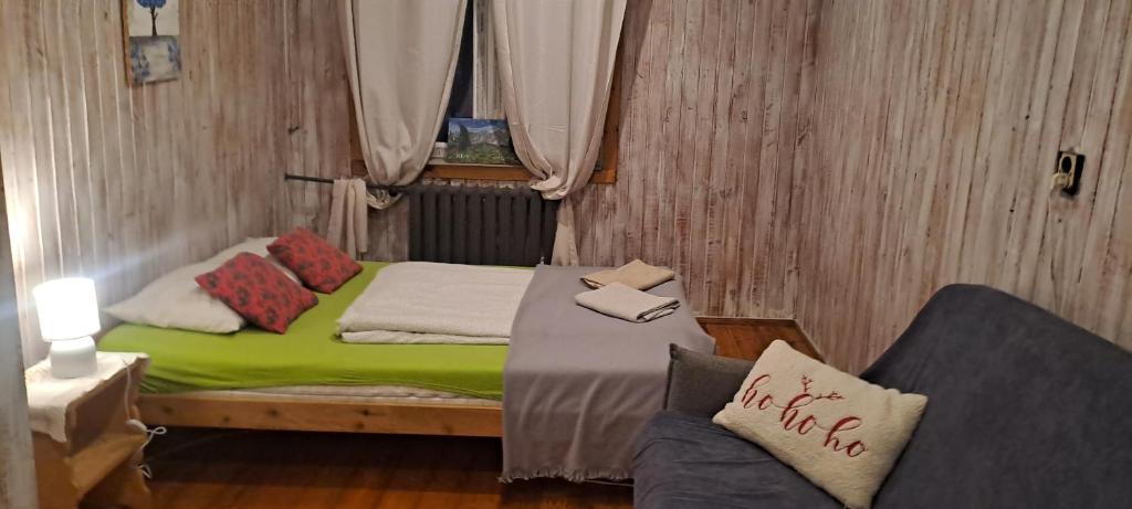 Postel nebo postele na pokoji v ubytování Schody Do Nieba