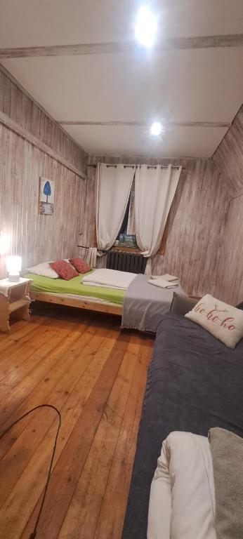 Postel nebo postele na pokoji v ubytování Schody Do Nieba