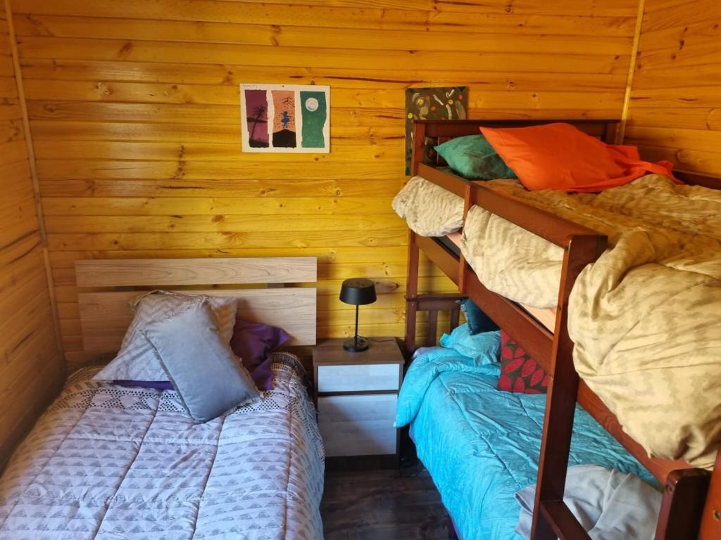 Postel nebo postele na pokoji v ubytování Cabañas Alto Quillay, radal siete tasas