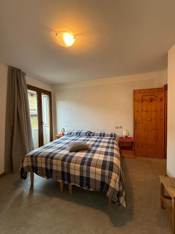 A bed or beds in a room at Appartamento Marco