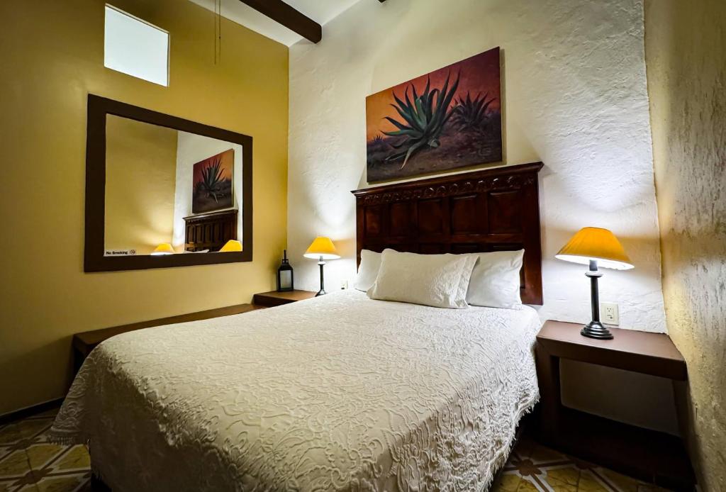 Postel nebo postele na pokoji v ubytování Hotel Casa San Miguel