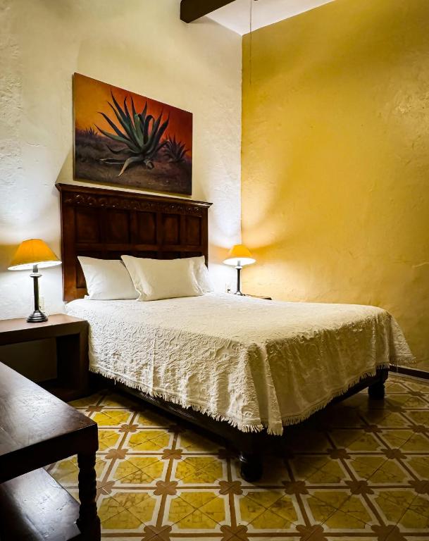 Postel nebo postele na pokoji v ubytování Hotel Casa San Miguel