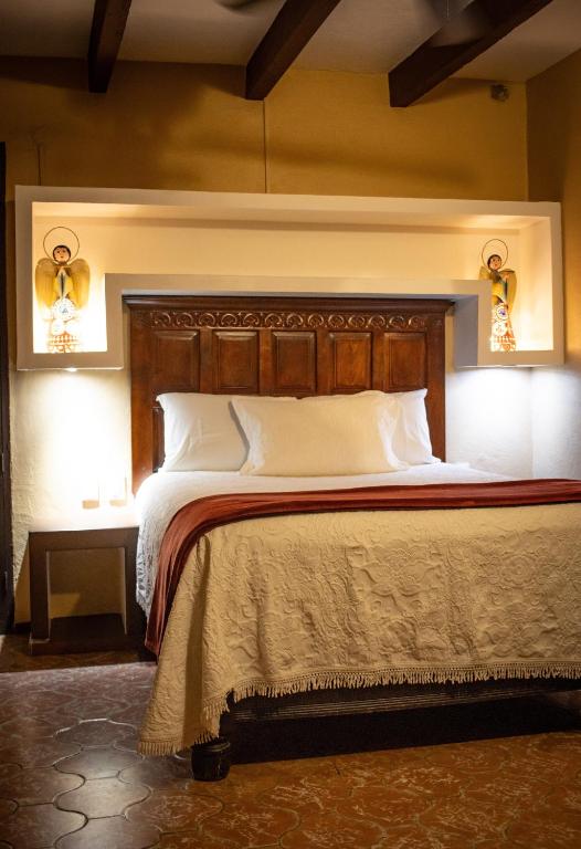 Postel nebo postele na pokoji v ubytování Hotel Casa San Miguel