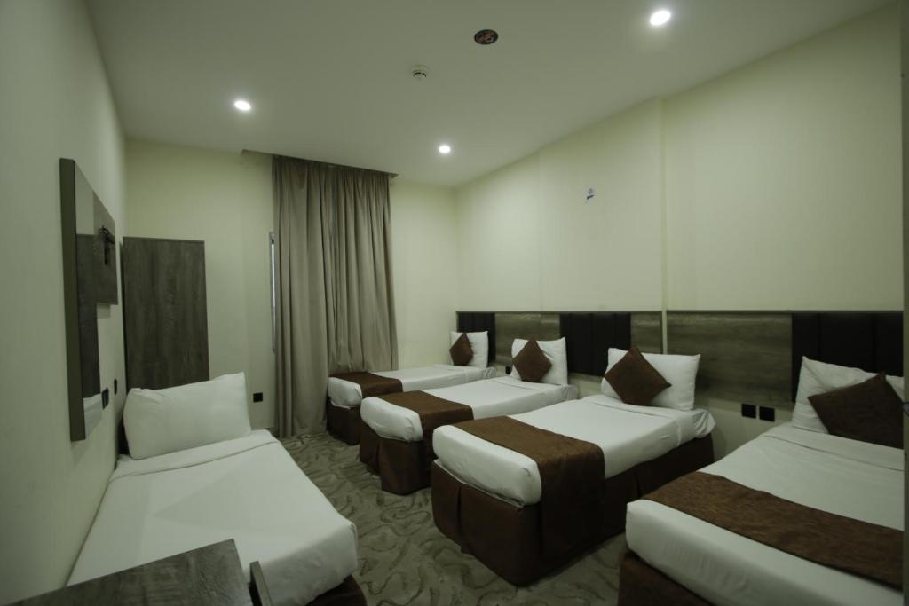 Postel nebo postele na pokoji v ubytování Mila HOTEL MAKKAH