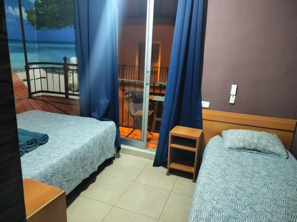 Postel nebo postele na pokoji v ubytování Sant Jordi Cami de Ronda