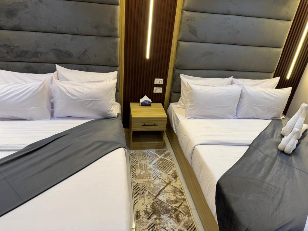 Postel nebo postele na pokoji v ubytování Giza Pyramids Boutique Hotel